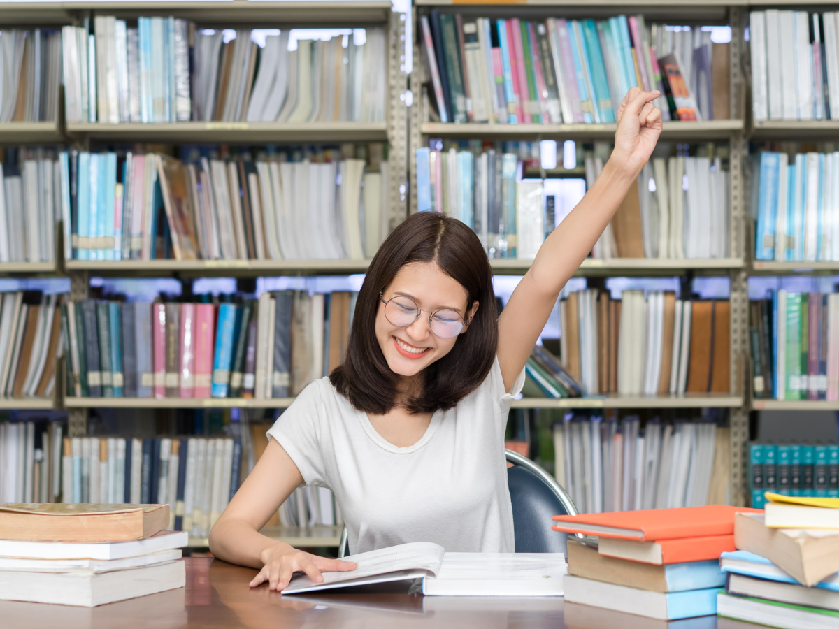 Successful student with fist in the air