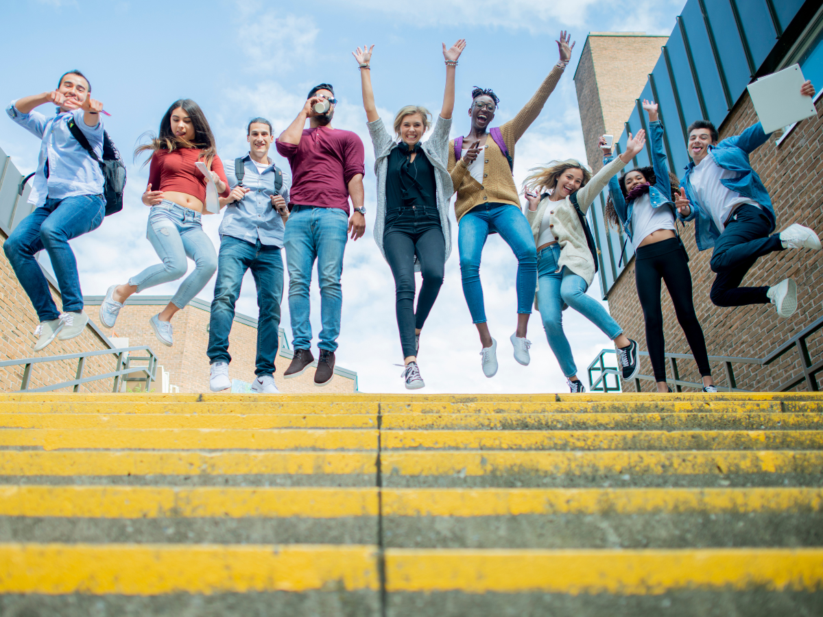 University students jumping in the air celebrating