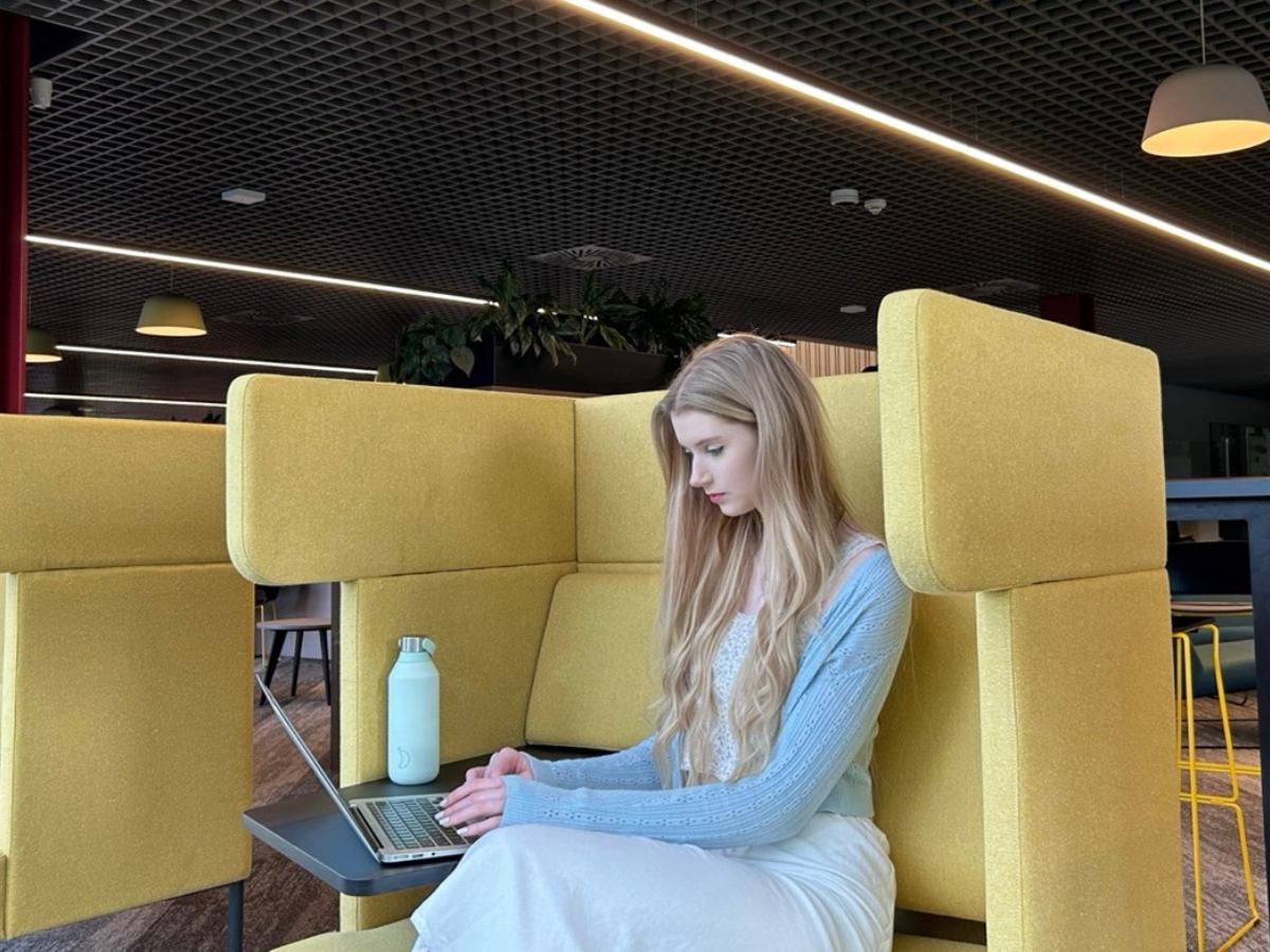 Megan Murray sitting working on a computer