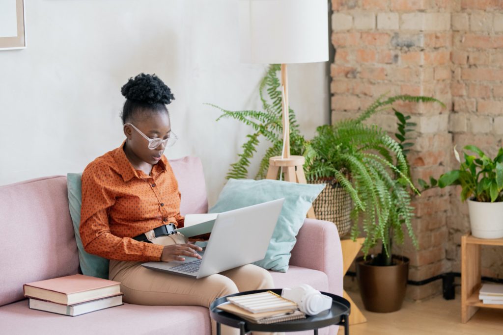 young Afrrican woman working remotely at home