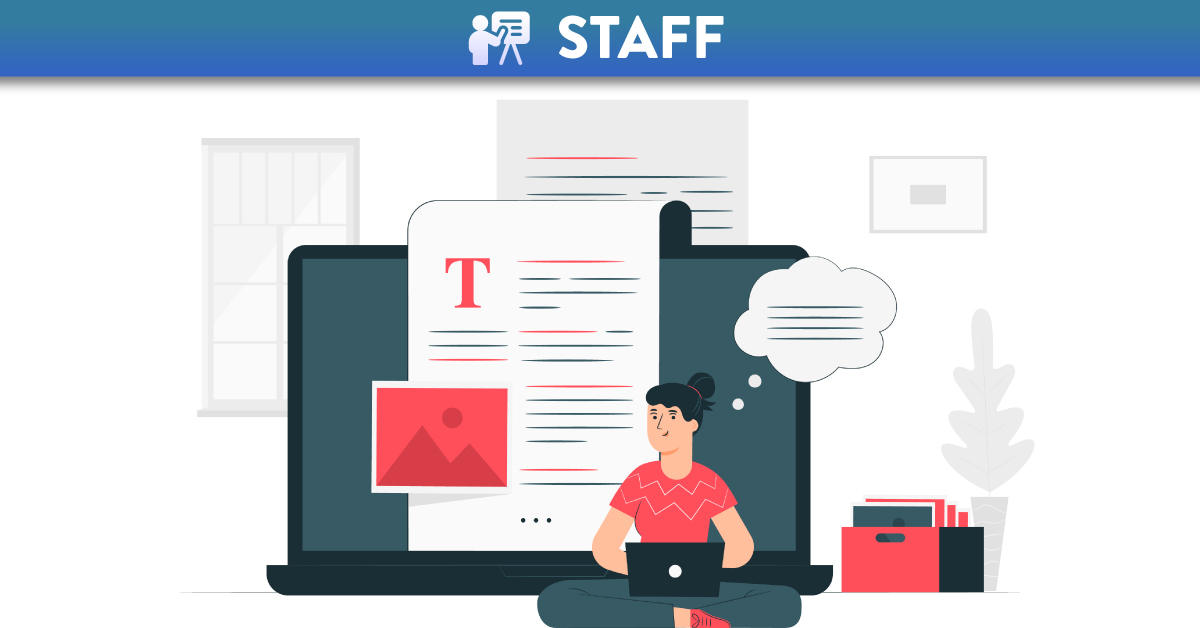 Girl sitting on ground typing on laptop