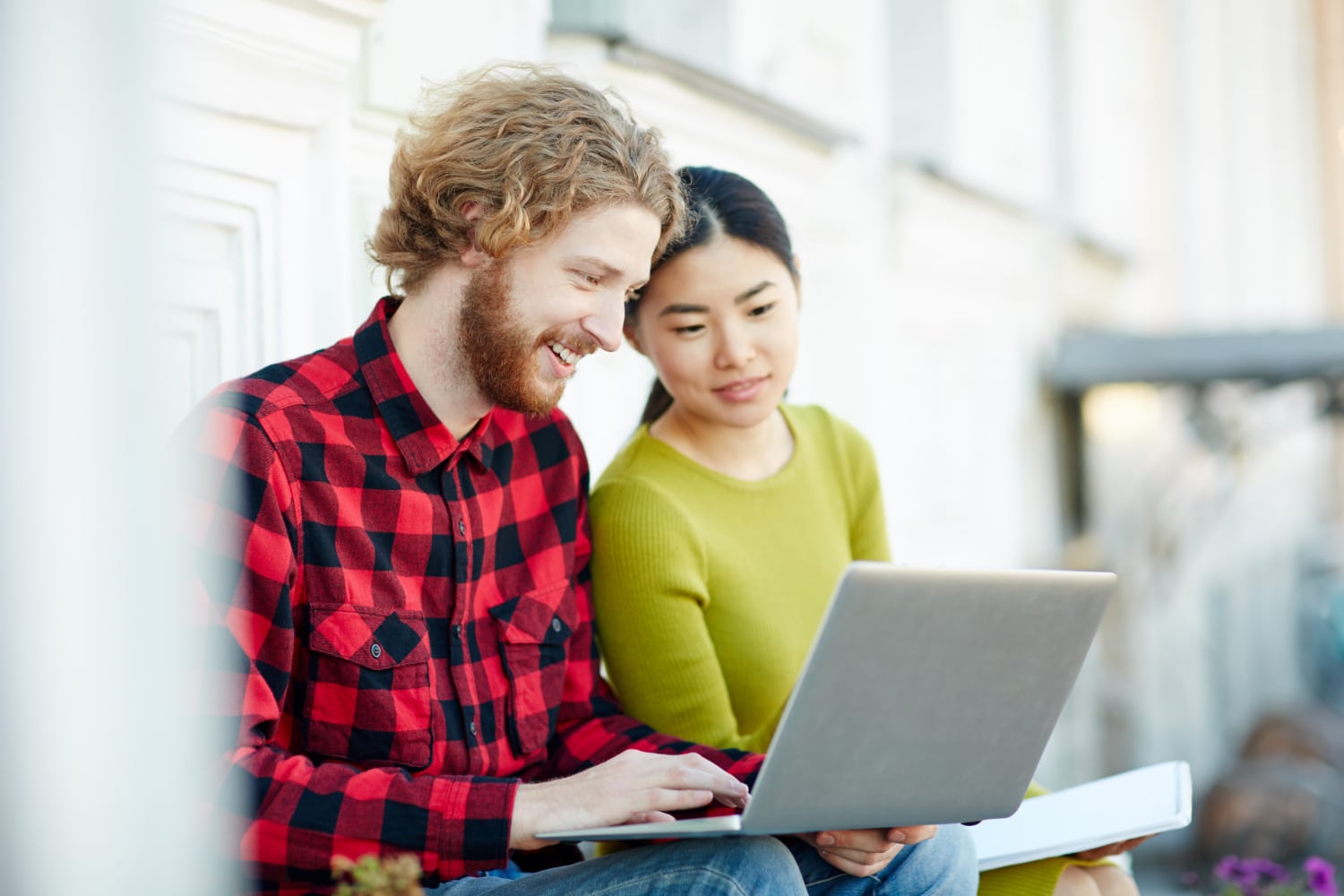 Man and woman looking at a laptop