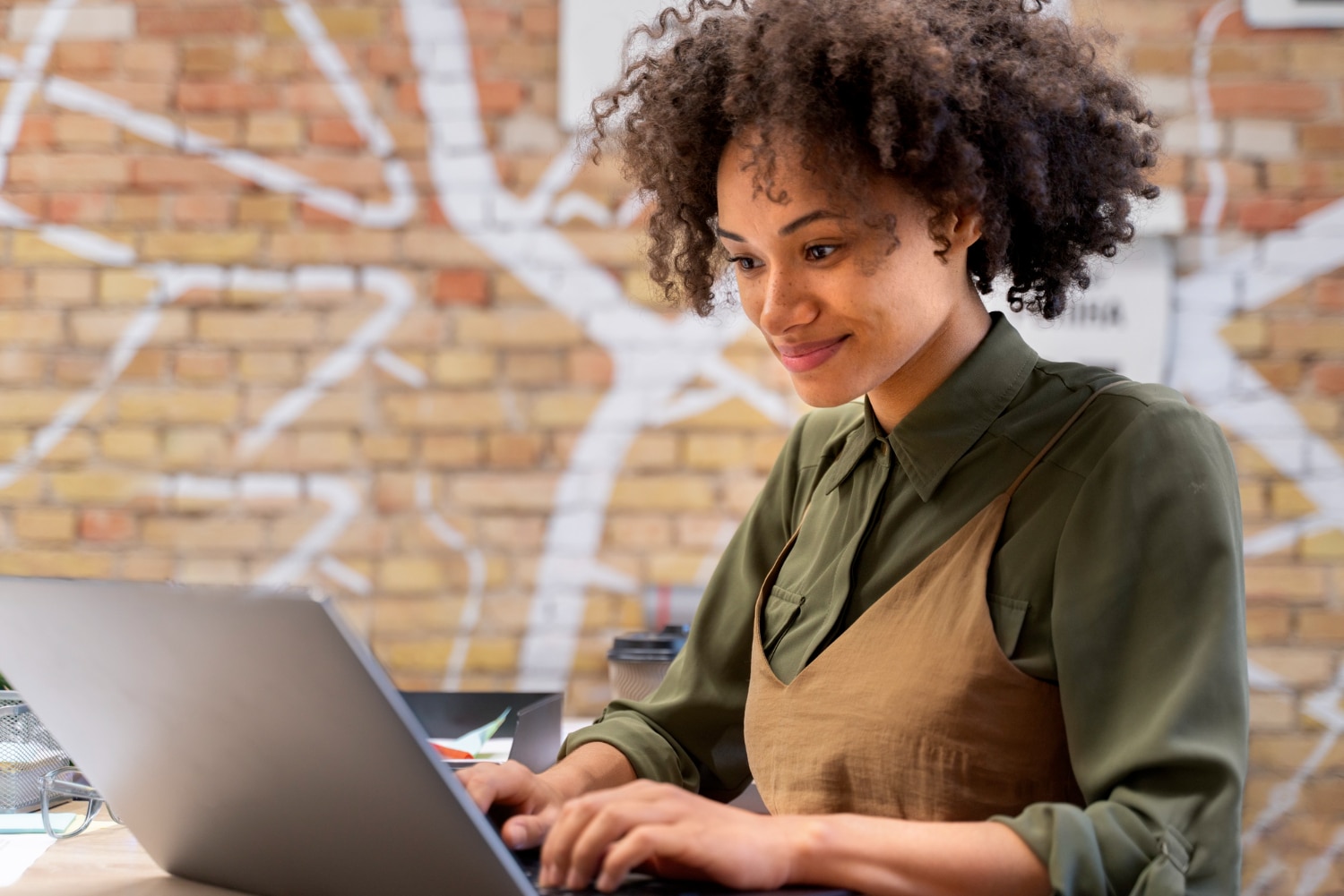 Close up on young businesswoman working on a laptop