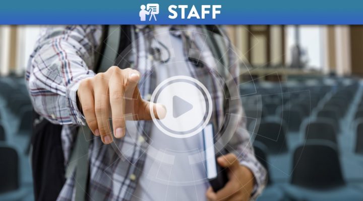 Person pushing holographic video play button