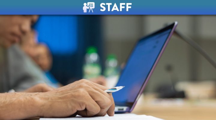 Side view of someone using a laptop