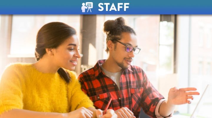 Man and woman collaborating together on a laptop