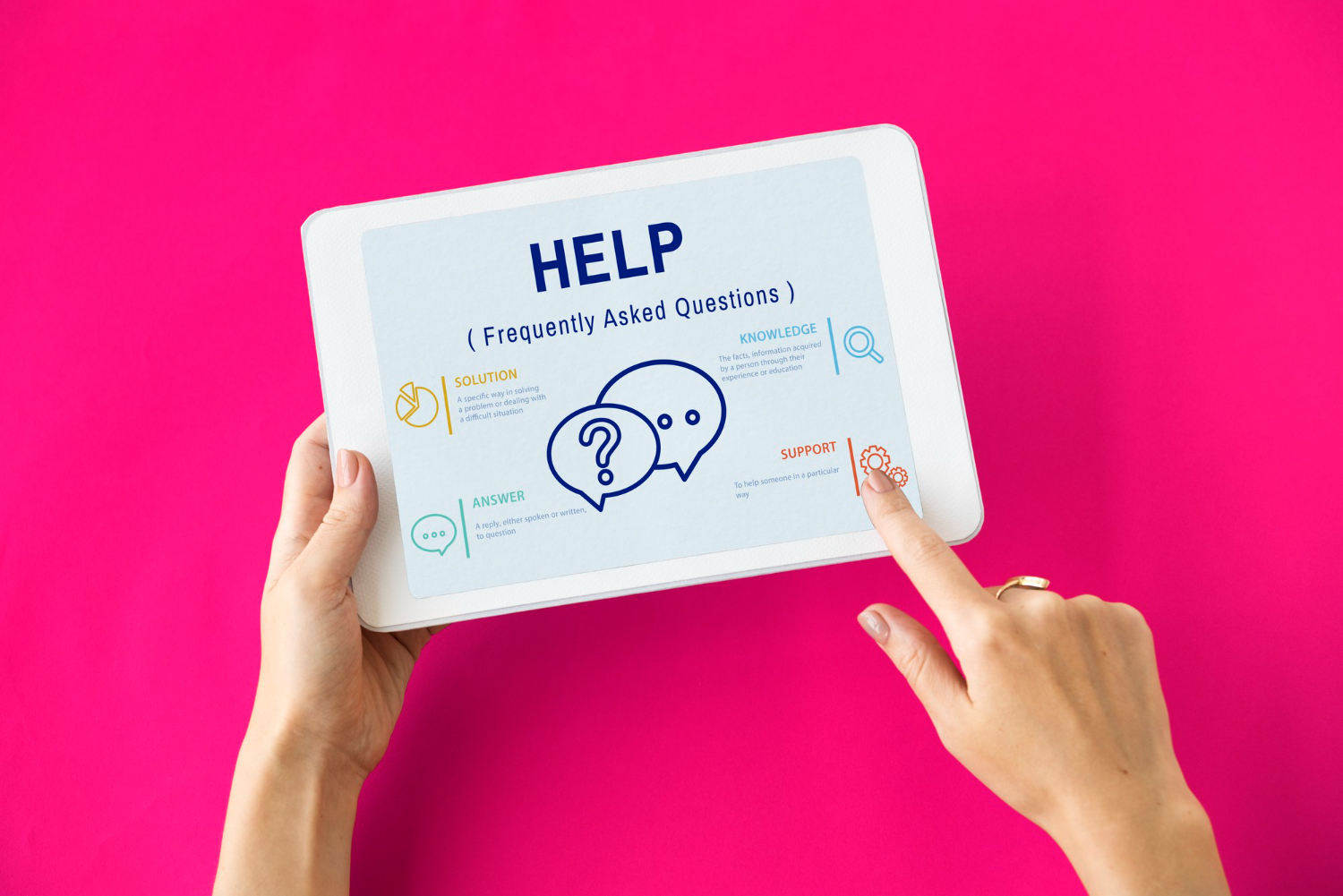 Hands holding a tablet with a help screen