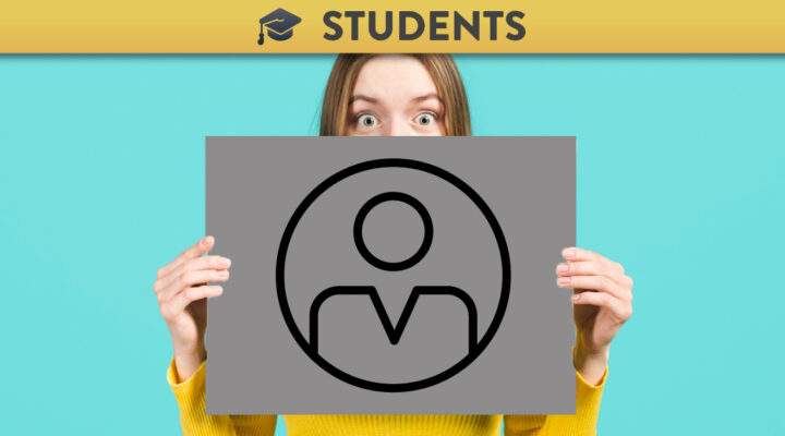 Woman holding up a card with the Jisc icon for ICT Proficiency