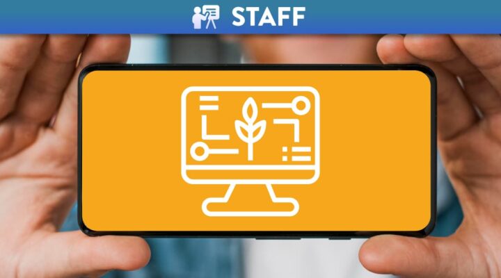 Person holding phone sideways with the Jisc icon for Digital Learning and Teaching