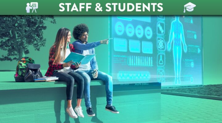 students sitting looking at floating digital screen