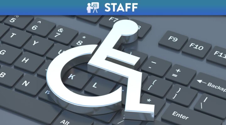 Wheelchair icon on black computer laptop keyboard 3d illustration