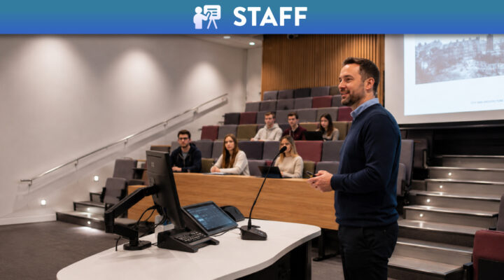 Academic in lecture theatre teaching students