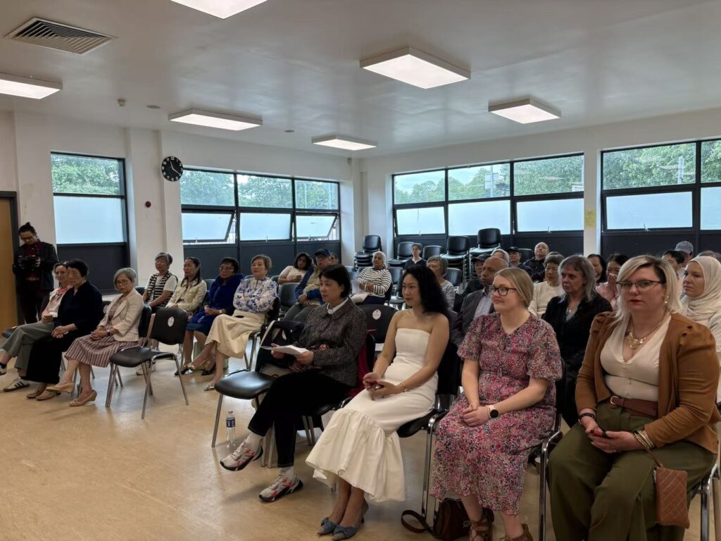 Audience waiting in the hall for the start.