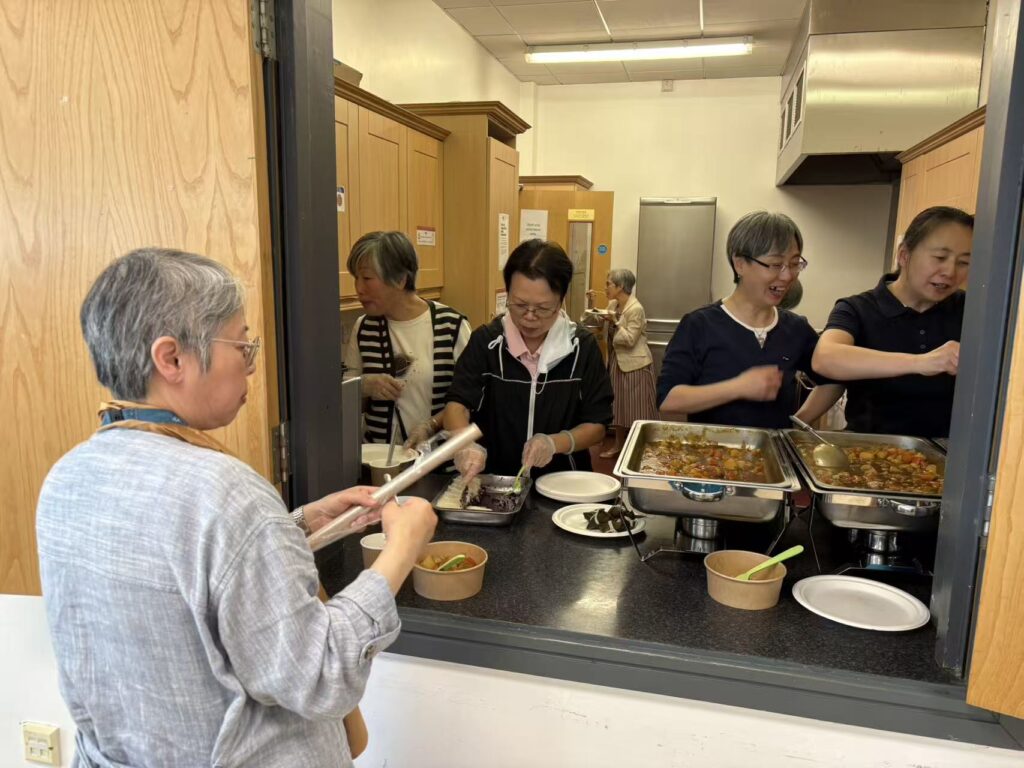 Volunteers busy preparing food.