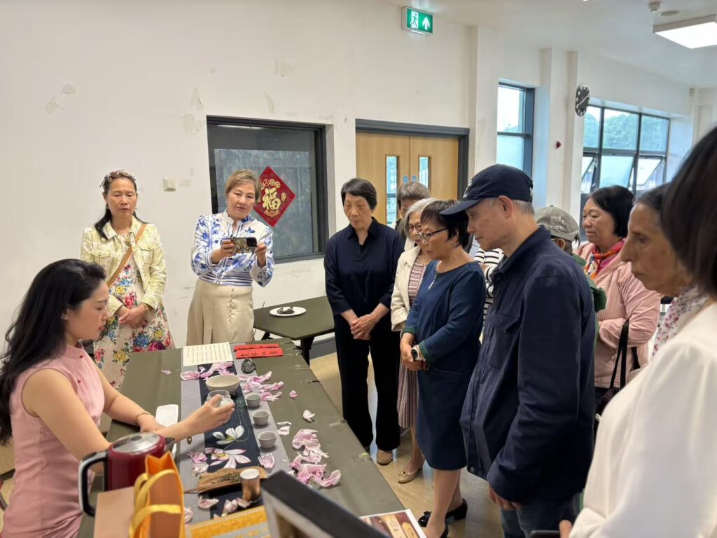 Wei Deng demoed tea making technique