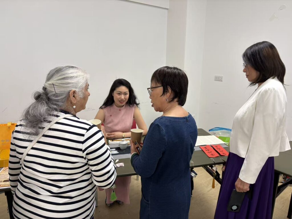 Wei surrounded by participants