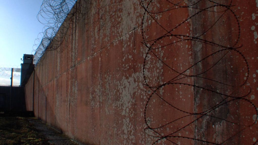 Rusted wall with wire over it at the Maze