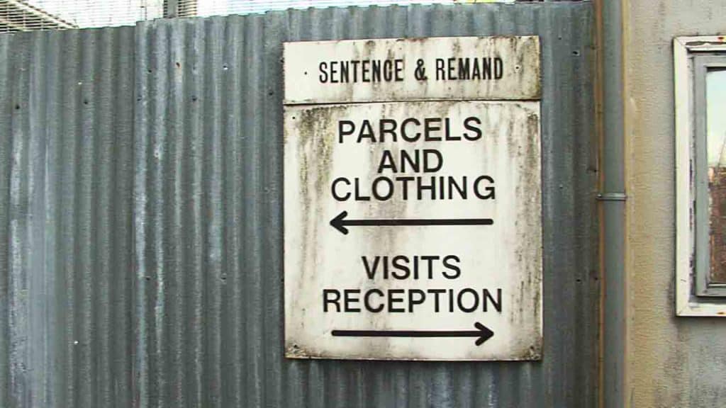 Signs saying Parcels and Visits Reception