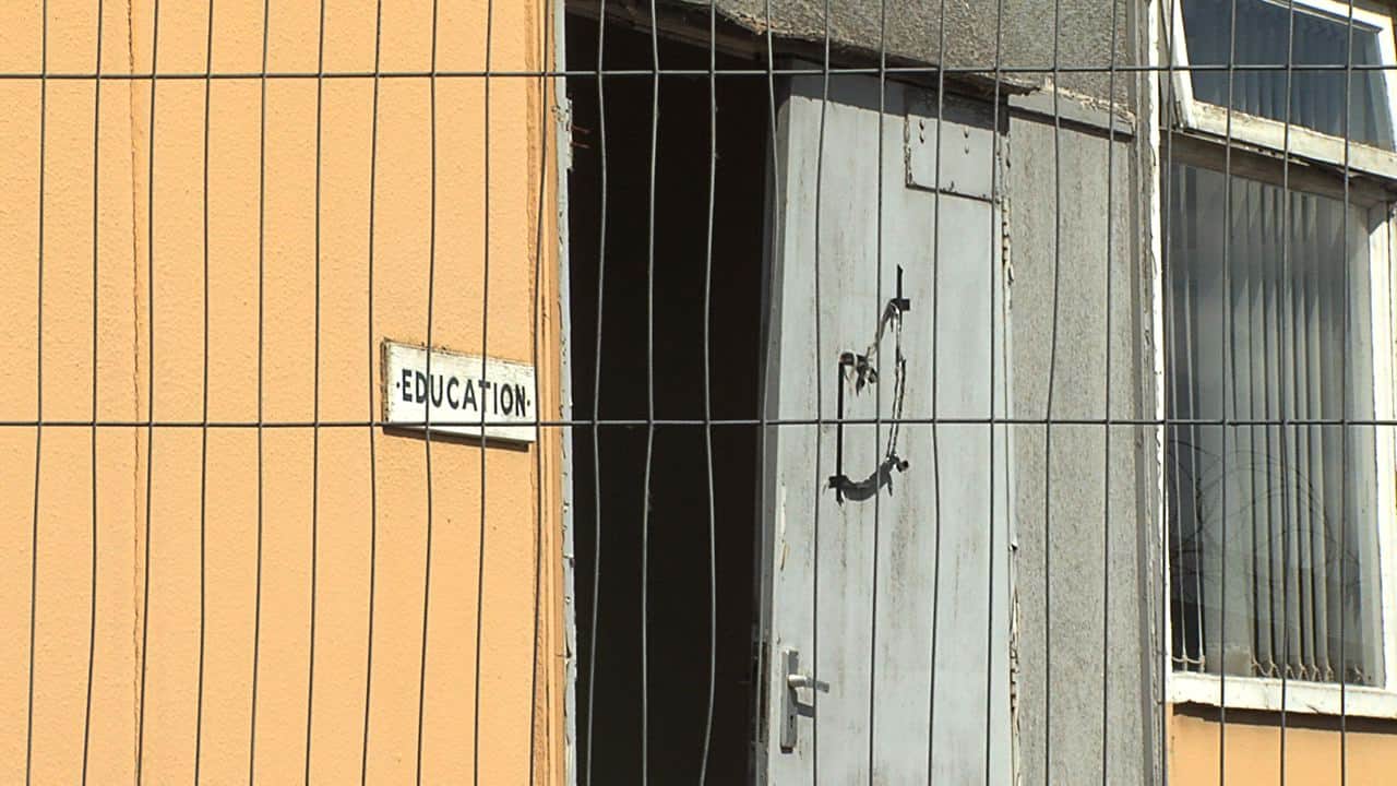 Education building viewed from fence