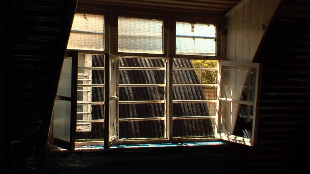 A visual of one of the broken windows inside one of the compounds.