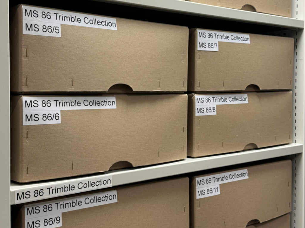 Photograph of archival boxes labelled "MS 86 Trimble Collection".