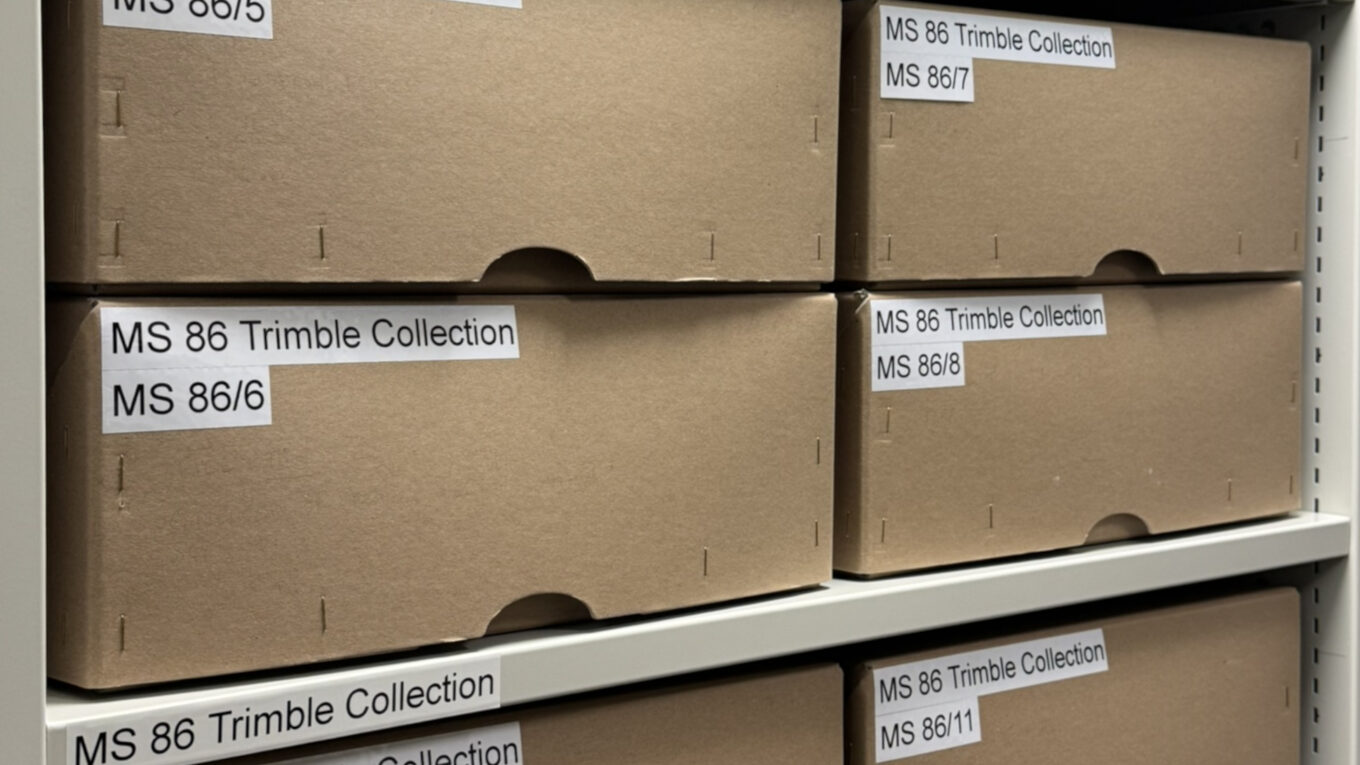 Photograph of archival boxes labelled "MS 86 Trimble Collection".