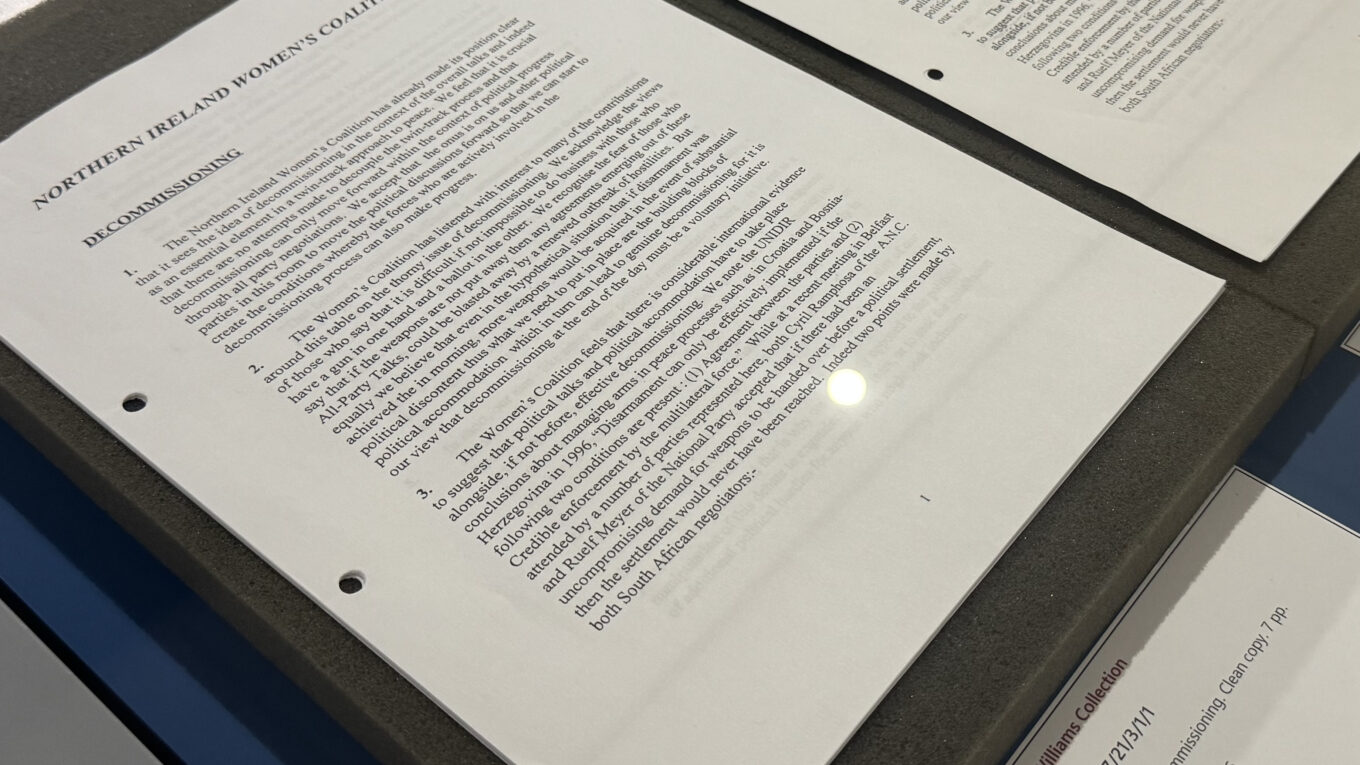 Document titled "NIWC Statement on Proposals for Decommissioning" in a display case with accompanying label.