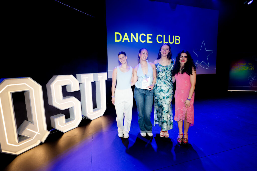 Dance Club on stage winning their award