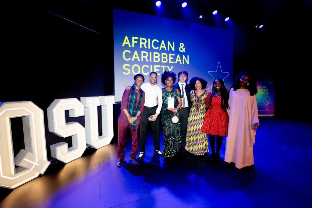 African & Caribbean Society on stage winning their award