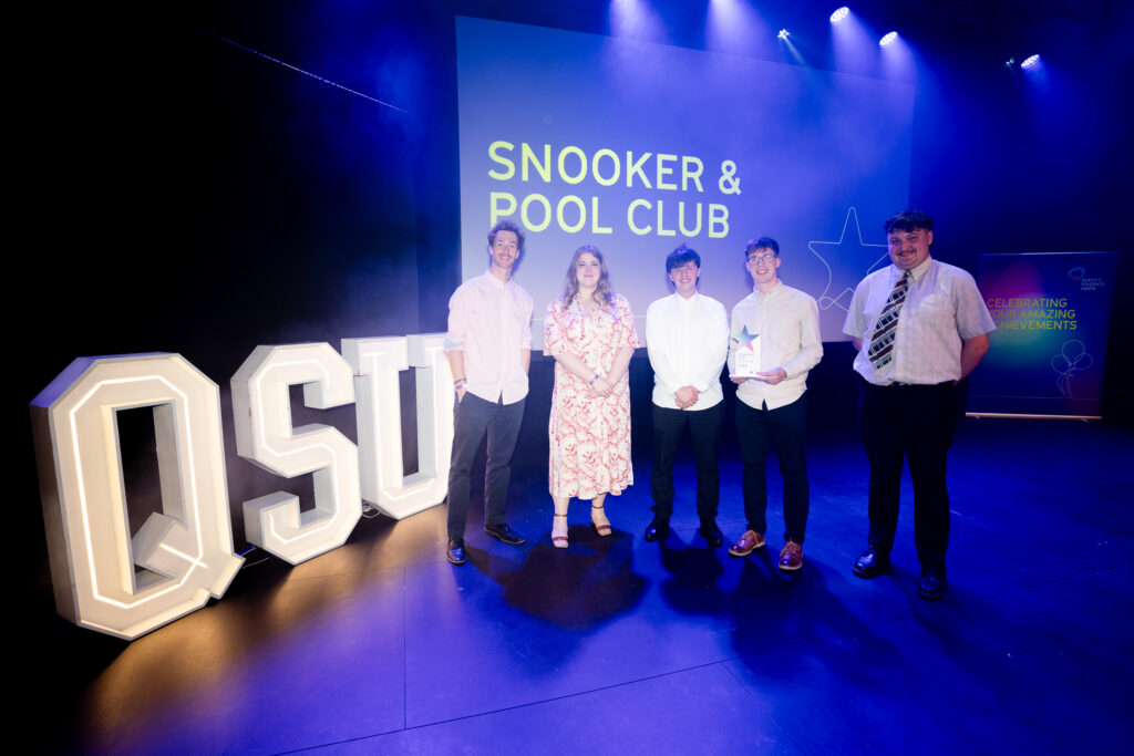 Snooker & Pool Club on stage winning their award