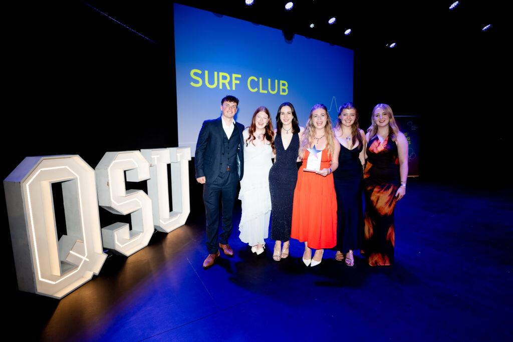 Surf Club on stage winning their award