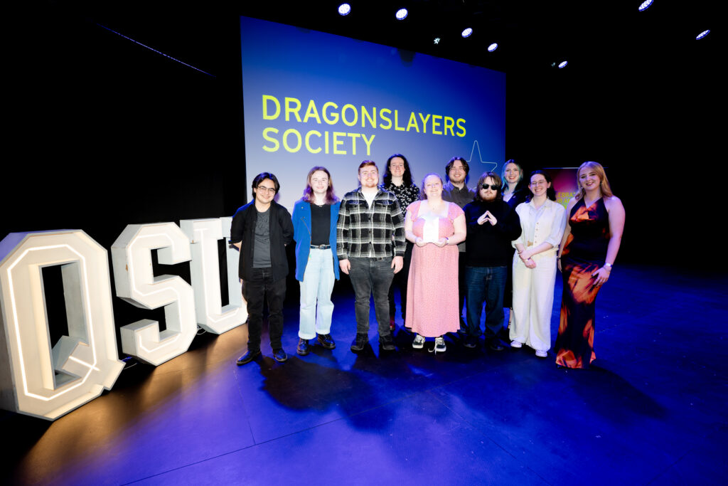 Dragonslayers Society on stage winning their award