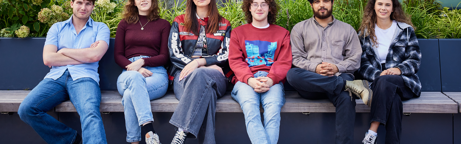 Image of the Student Officers sitting outside the Students' Union