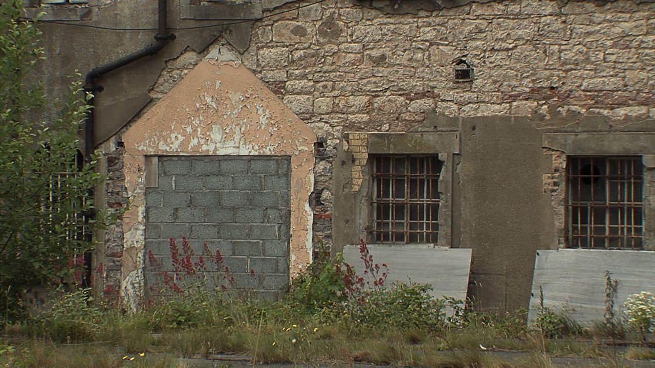 The Armagh Gaol door bricked up and windows boarded up. The Armagh Gaol door bricked up and windows boarded up.
